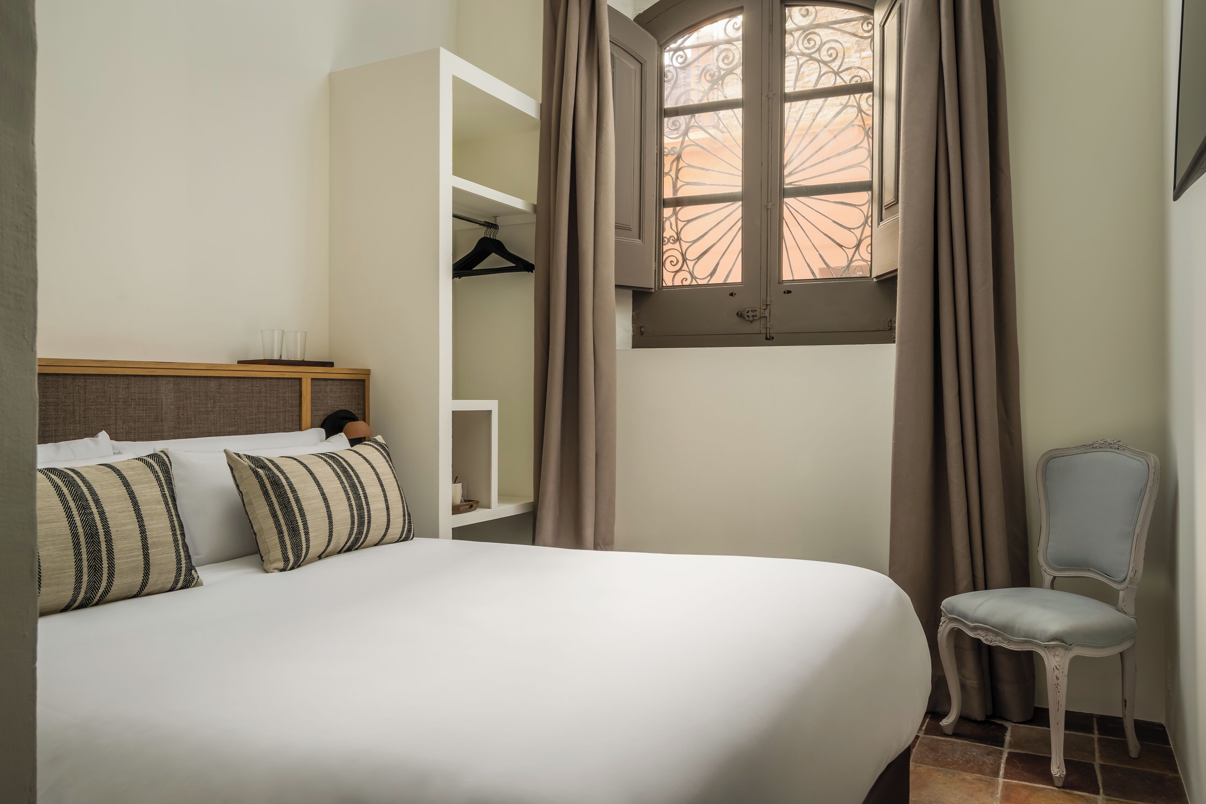 Economy Room, Ground Floor | Down comforters, individually decorated, free WiFi, bed sheets