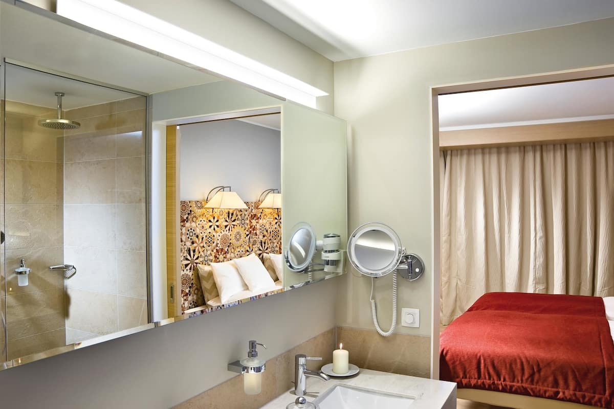 rainfall showerhead, designer toiletries, hair dryer, bathrobes