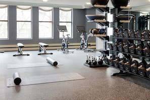 A gym with exercise equipment, treadmills, and dumbbells. - Kimpton Hotel Monaco Philadelphia by IHG (Philadelphia)