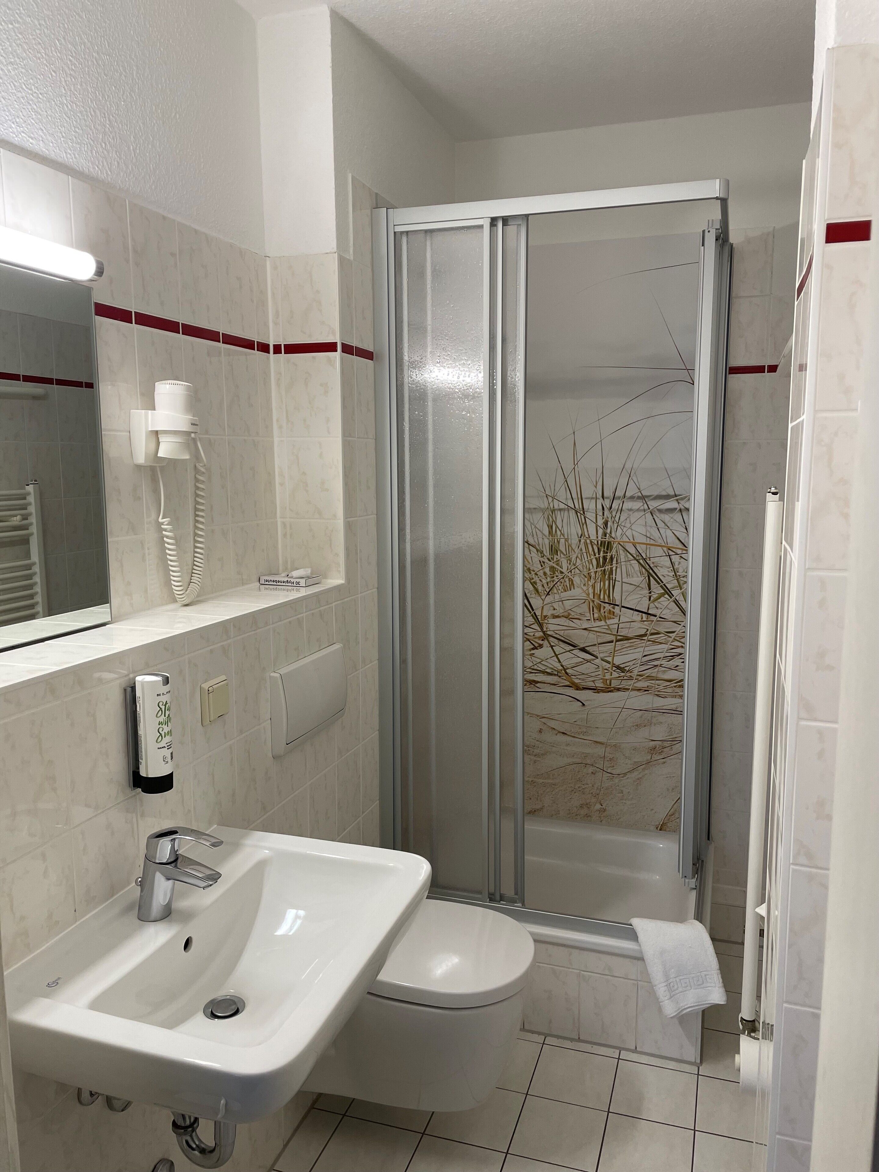 shower, free toiletries, hair dryer, towels