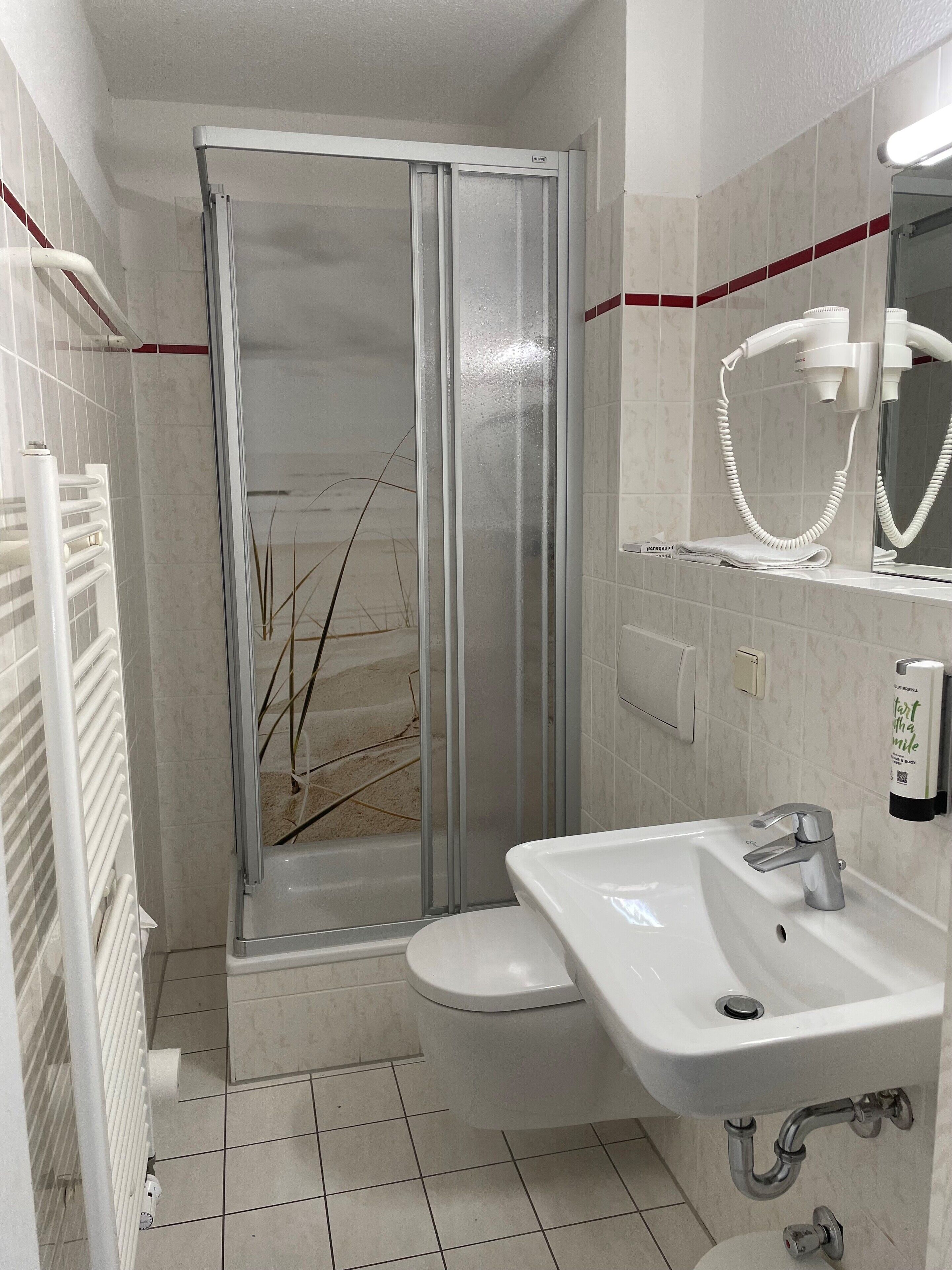 shower, free toiletries, hair dryer, towels