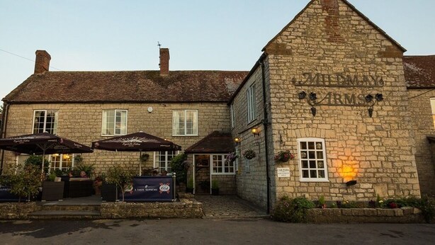 A stone building with a sign reading "The Smiths." - Mildmay Arms (Yeovil)