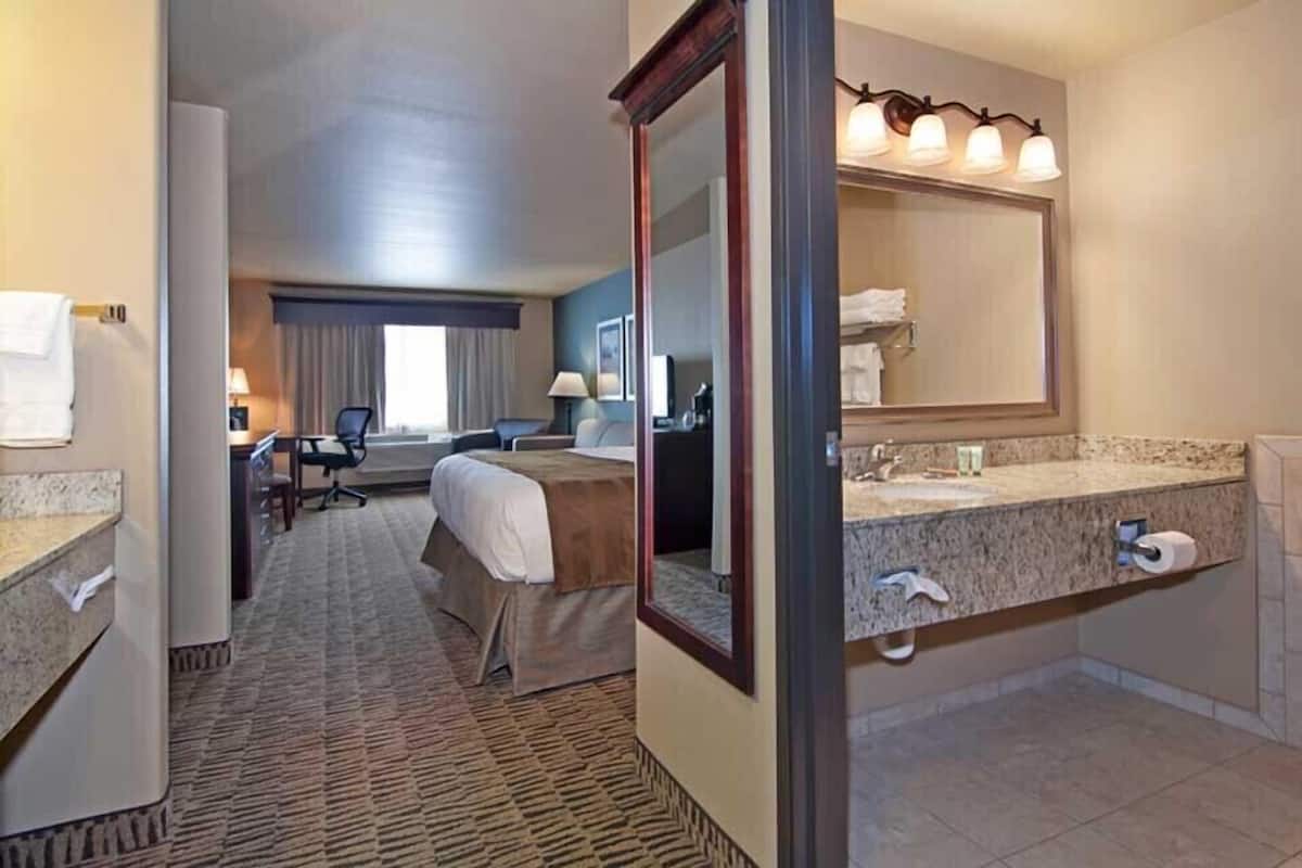 desk, laptop workspace, iron/ironing board, rollaway beds