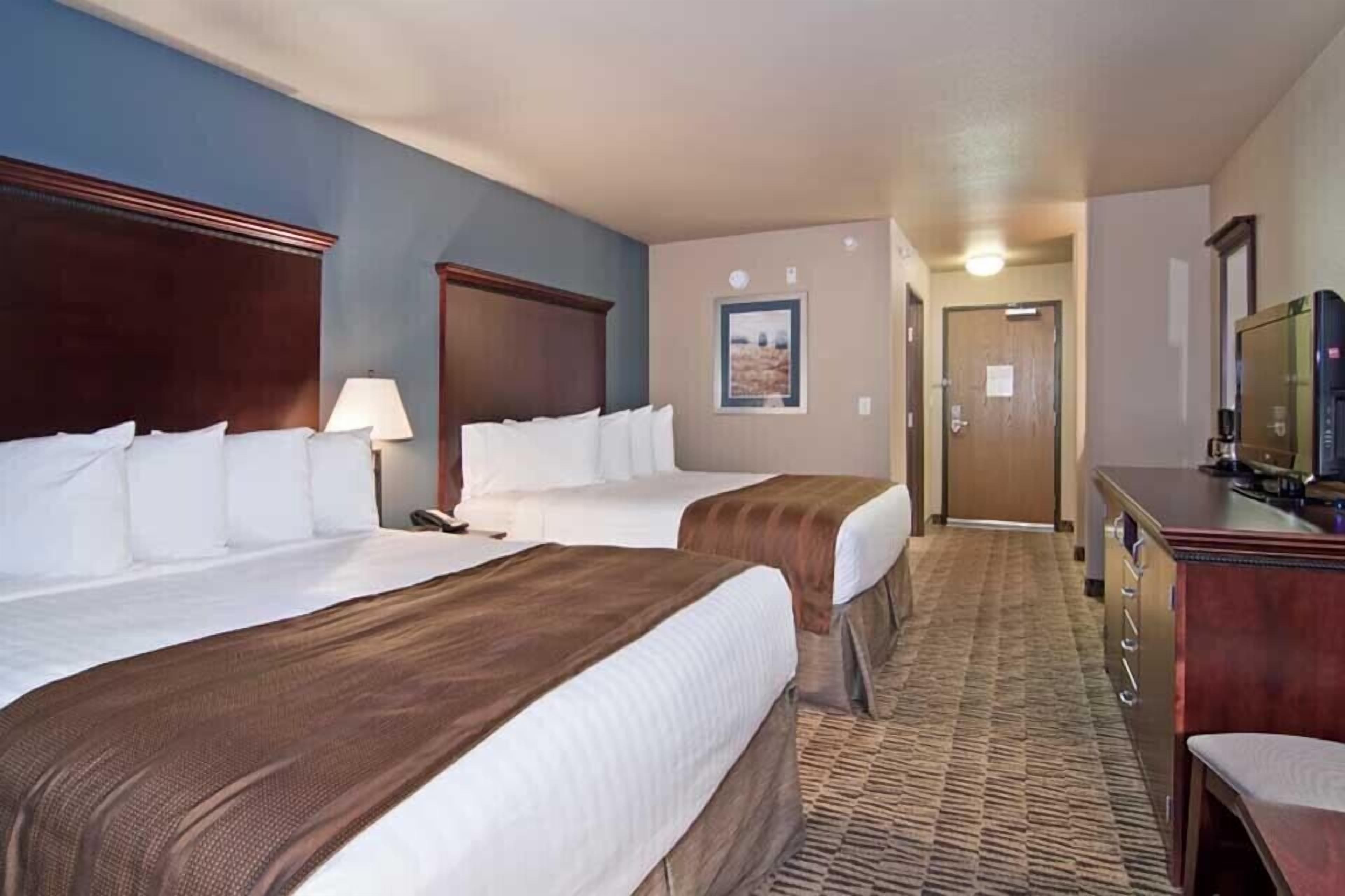 desk, laptop workspace, iron/ironing board, rollaway beds