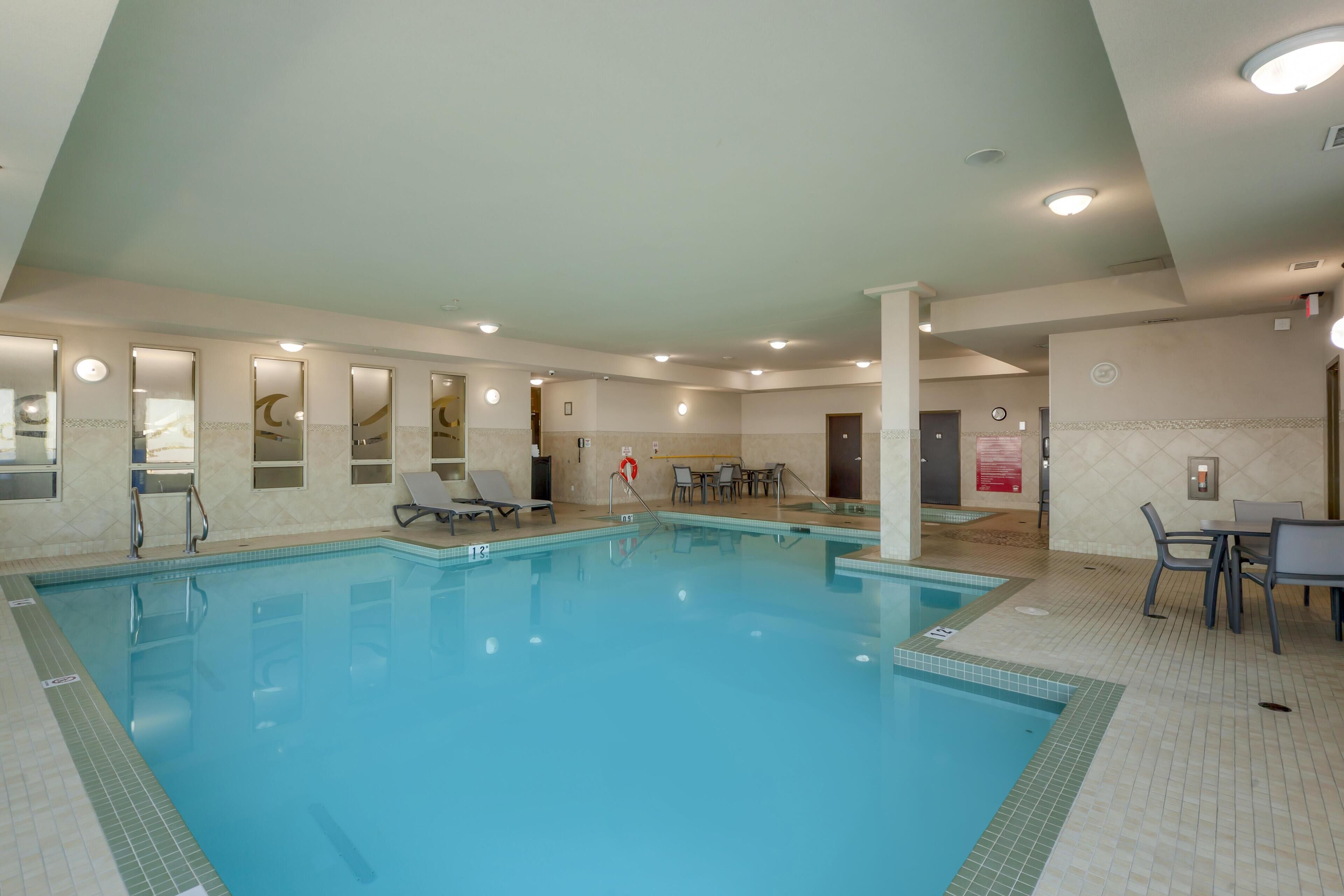 Indoor pool, open 6:00 AM to 10:00 PM, pool loungers