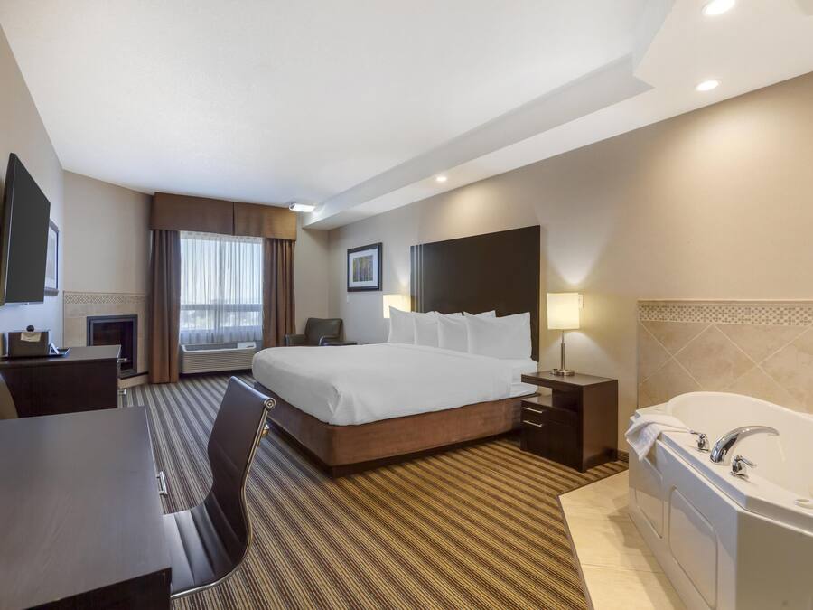 Suite, 1 cama de matrimonio grande, no fumadores, bañera de hidromasaje | Escritorio y espacio para trabajar con un portátil