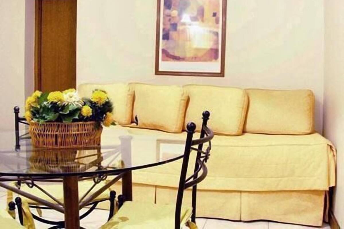 Classic Triple Room | Living room | 29-inch TV with cable channels