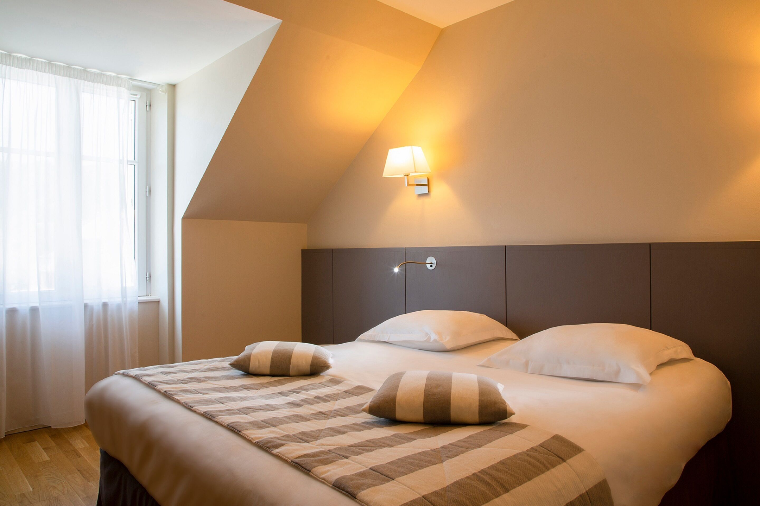 premium bedding, memory-foam beds, desk, laptop workspace