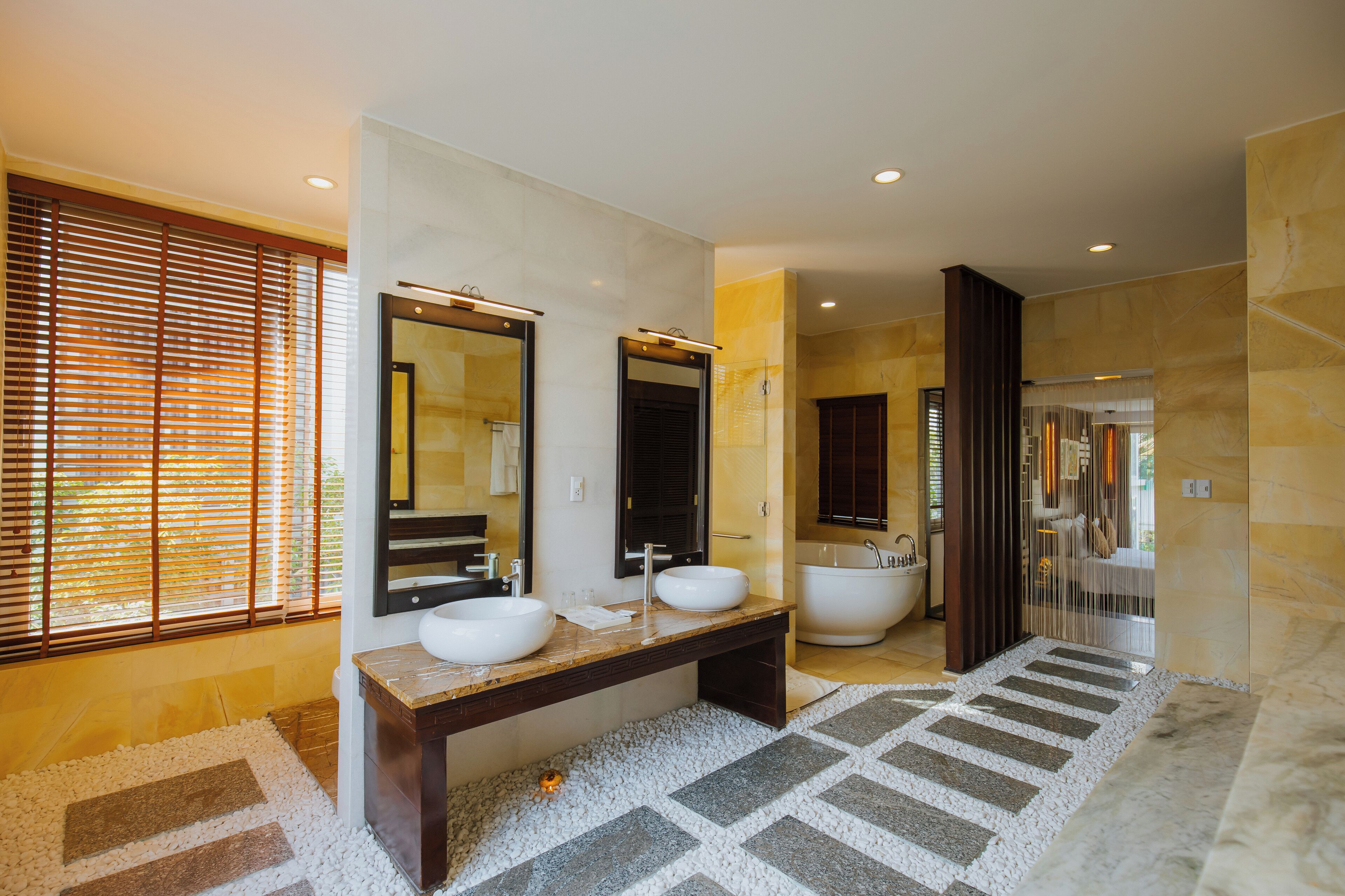 designer toiletries, hair dryer, bathrobes, slippers