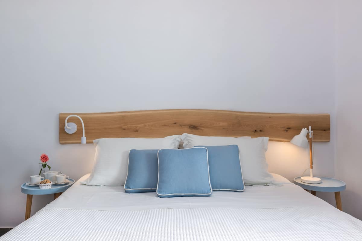 superior room (caldera view) | premium bedding, in-room safe, blackout curtains, iron/ironing board