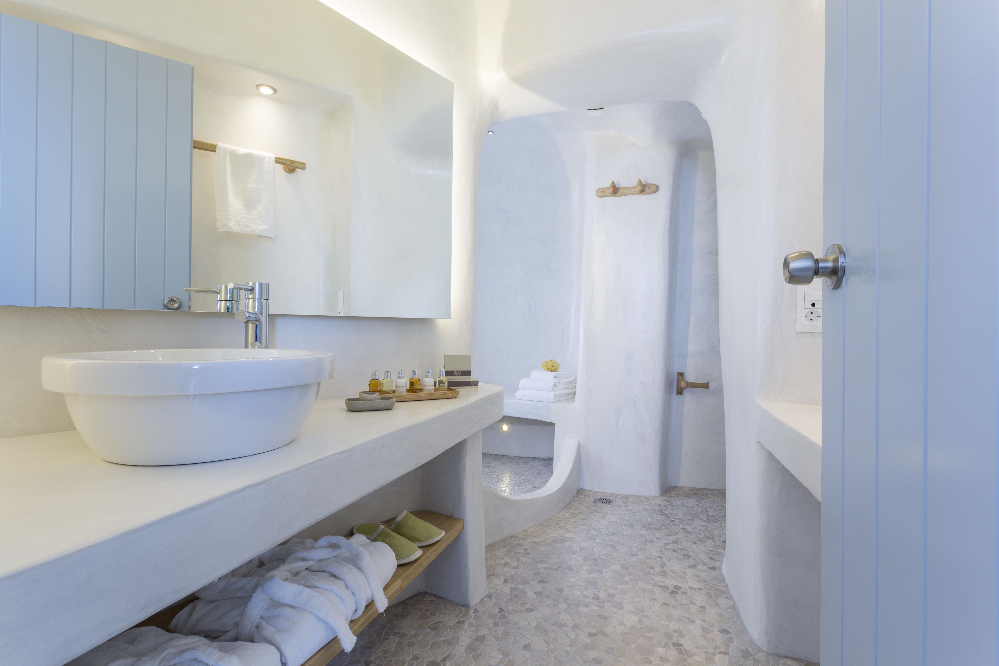 junior villa (outdoor heated jetted tub, caldera view) | bathroom | shower, designer toiletries, hair dryer, slippers