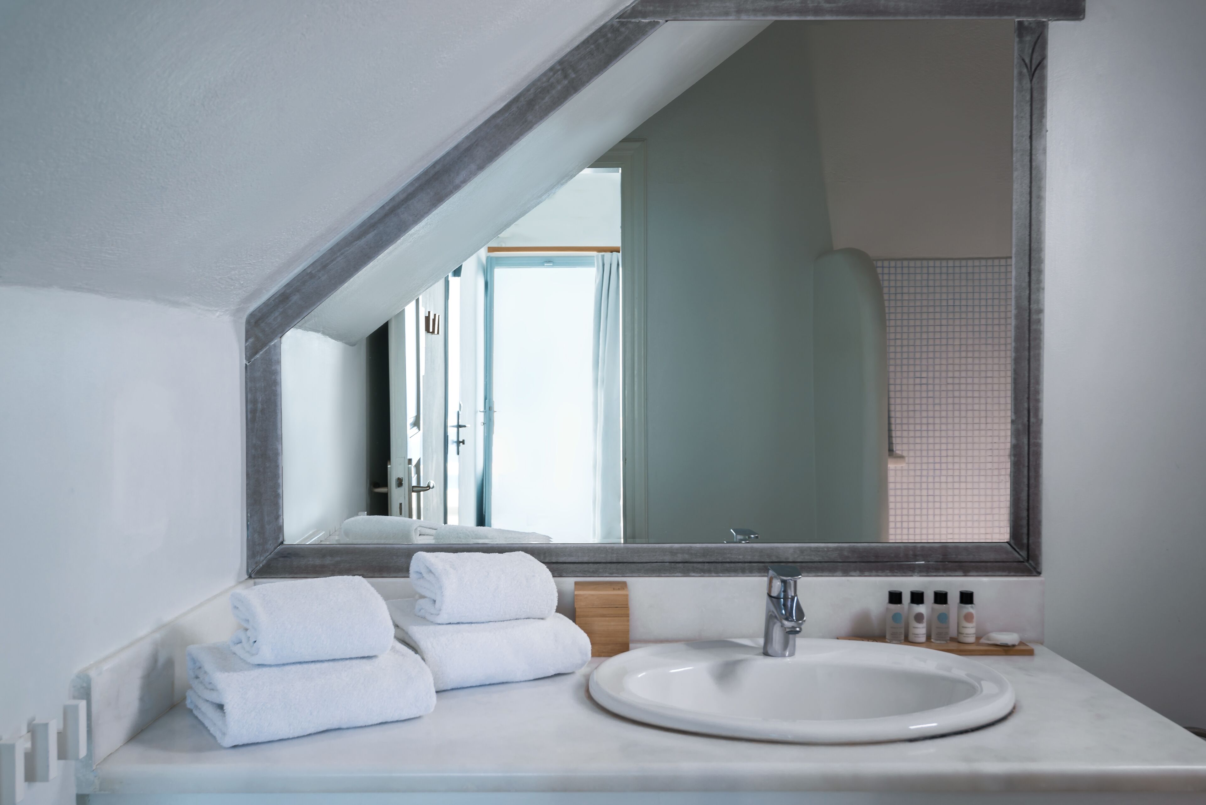 premier room (caldera view) | bathroom | shower, designer toiletries, hair dryer, slippers