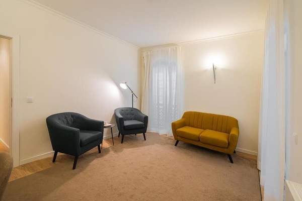 Suite, Balcony | Living area | 32-inch LCD TV with cable channels, books