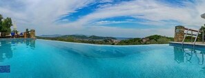 Outdoor pool, free pool cabanas, pool umbrellas
