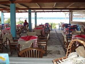 Breakfast, lunch, dinner served; Greek cuisine, beach views