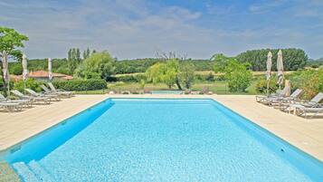 Seasonal outdoor pool, open 10:00 AM to 8:00 PM, pool umbrellas