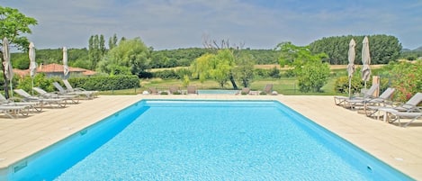 Seasonal outdoor pool, open 10:00 AM to 8:00 PM, pool umbrellas