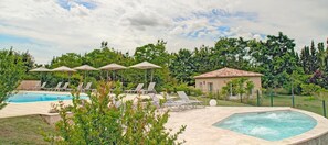 Seasonal outdoor pool, open 10:00 AM to 8:00 PM, pool umbrellas