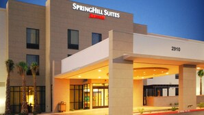 A modern hotel with a flat roof, large windows, and a prominent entrance. - SpringHill Suites Las Vegas North Speedway (North Las Vegas)