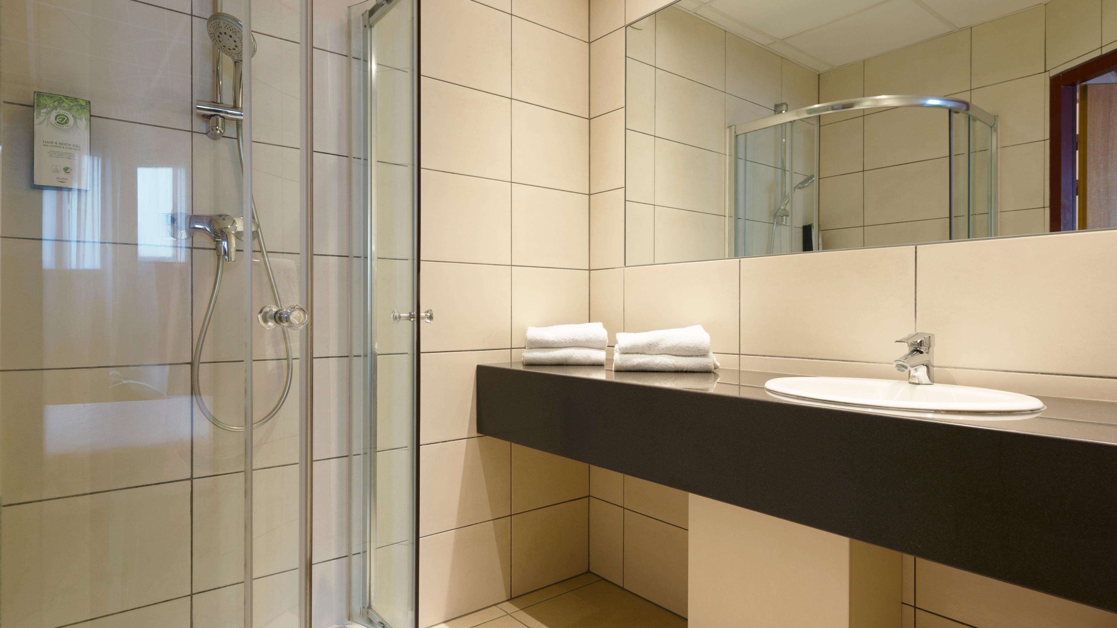 eco-friendly toiletries, hair dryer, towels, soap