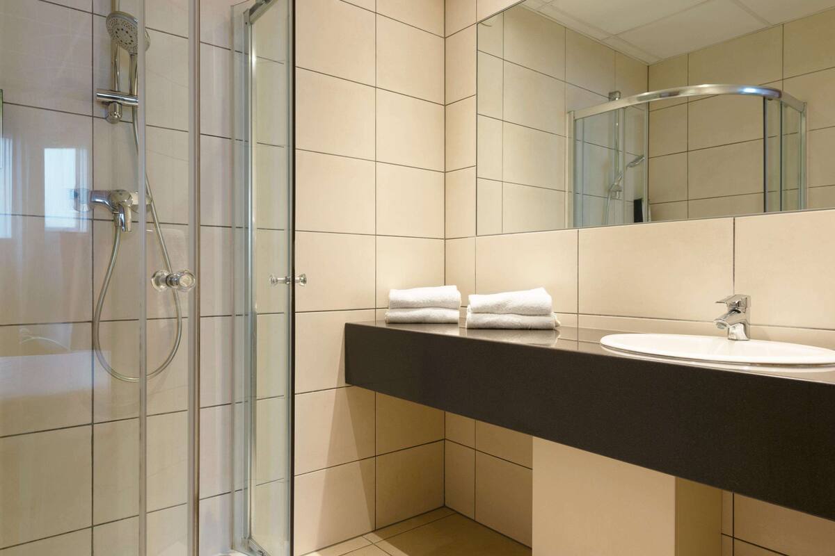 eco-friendly toiletries, hair dryer, towels, soap