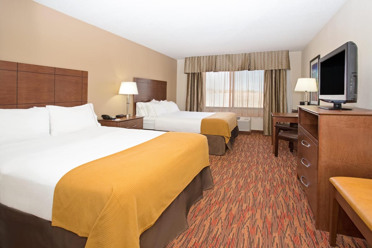 Premium bedding, down comforters, pillowtop beds, in-room safe