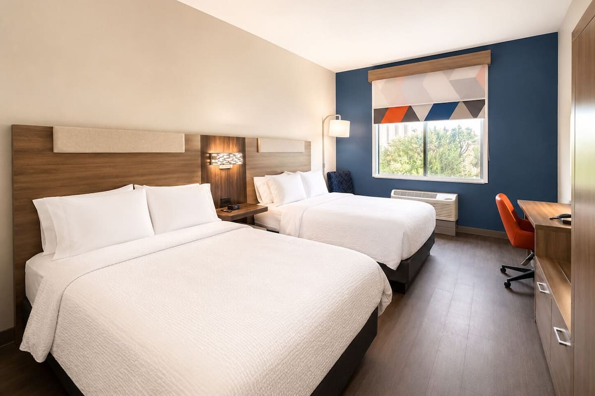 Premium bedding, down comforters, pillowtop beds, in-room safe