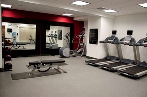 A gym with treadmills, a bench, and exercise equipment. - Homewood Suites by Hilton Doylestown (Warrington)