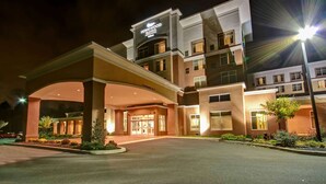 A multi-story hotel with a prominent entrance and a sign for Homewood Suites. - Homewood Suites by Hilton Doylestown (Warrington)