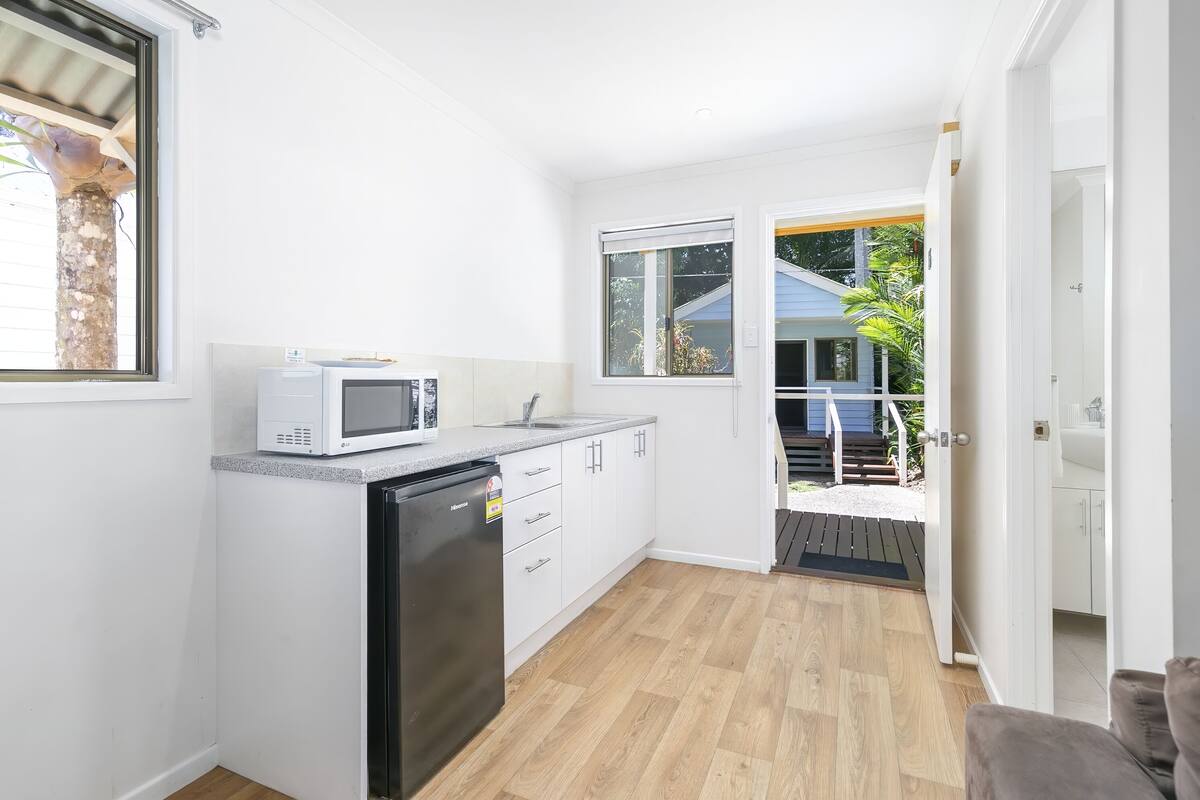 mini-fridge, microwave, cookware/dishes/utensils