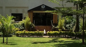 A building with a black roof and a sign reading "JACARANDA". - Jacaranda (Nairobi)