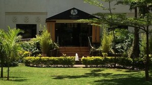 A building with a black roof and a sign reading "JACARANDA". - Jacaranda (Nairobi)