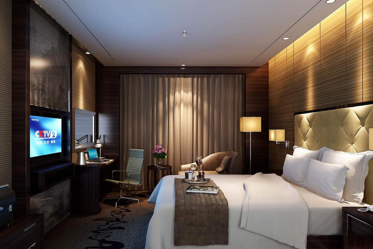 Camas con pillow-top, minibar y caja de seguridad en la habitación