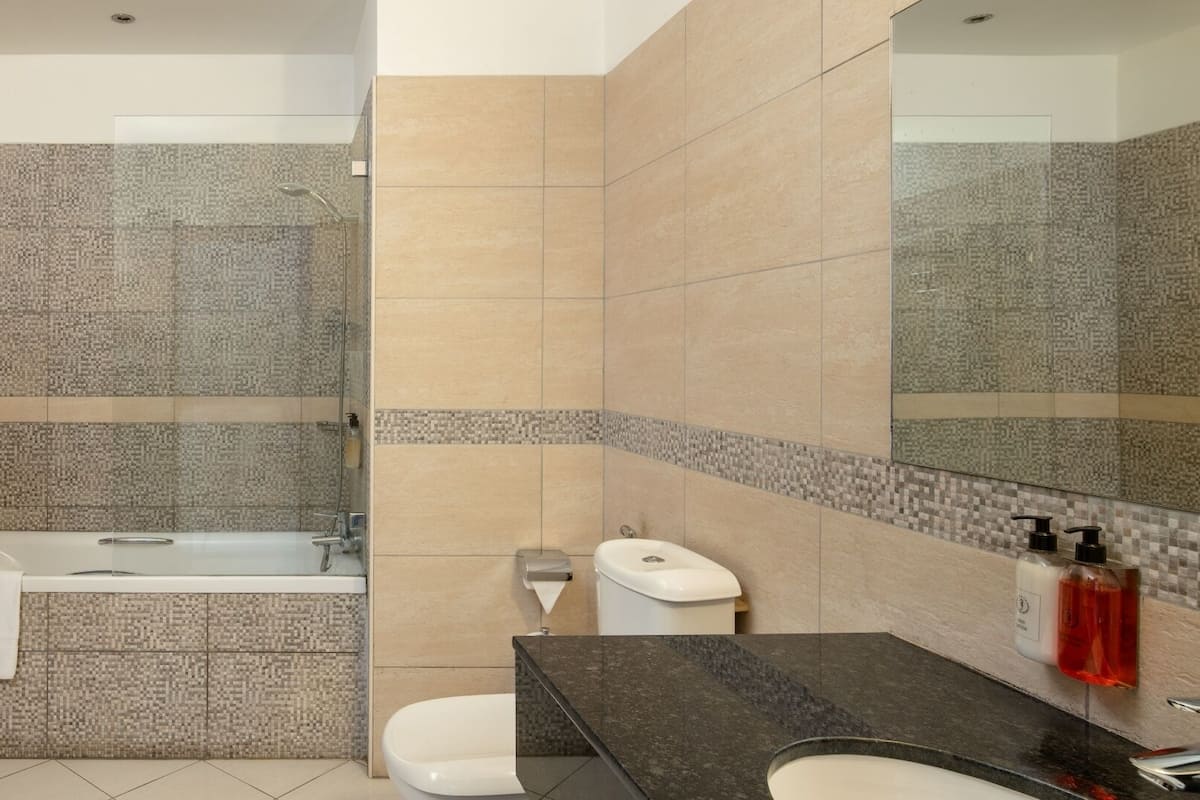 suite | bathroom | separate bathtub and shower, free toiletries, bathrobes, slippers