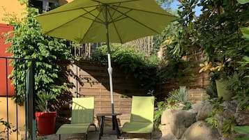 Seasonal outdoor pool, open 9:00 AM to 9:00 PM, pool umbrellas