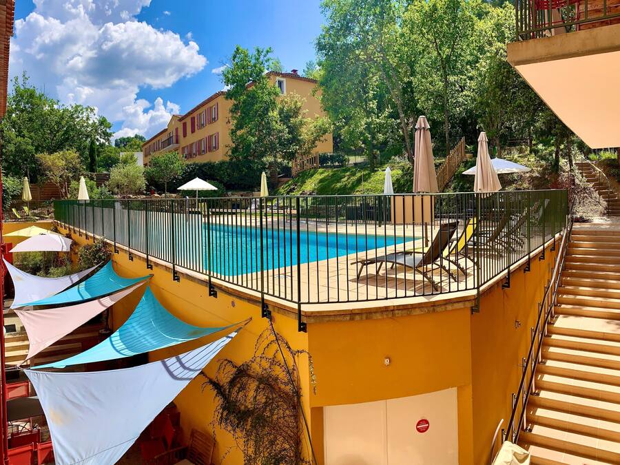 Seasonal outdoor pool, open 9:00 AM to 9:00 PM, pool umbrellas