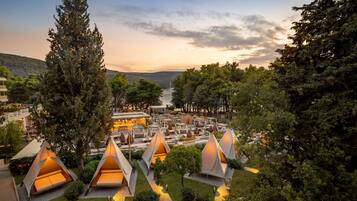 Experience a serene retreat amidst lush greenery and tranquil surroundings.