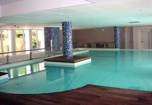 Indoor pool, outdoor pool, pool umbrellas, pool loungers