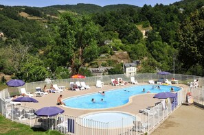 Indoor pool, outdoor pool, pool umbrellas, pool loungers