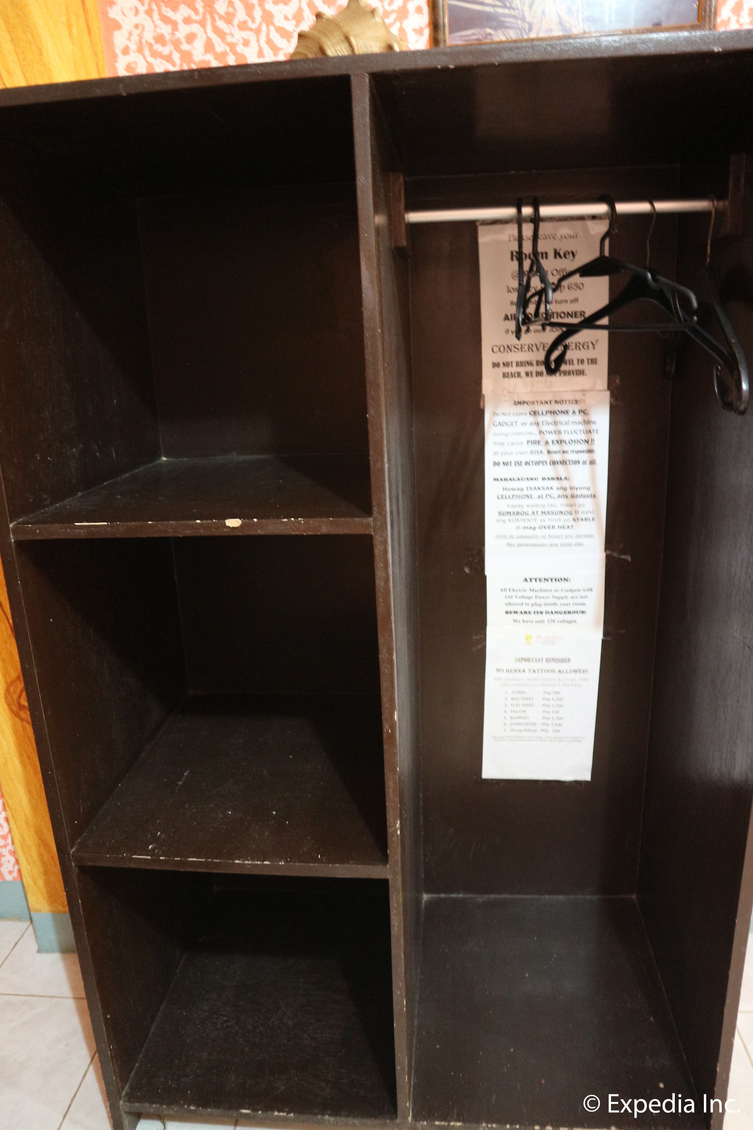 A dark wooden cabinet with a sign listing safety instructions.
