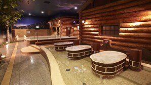 A log cabin-style spa with hot tubs and a sauna. - Spa World (Osaka)
