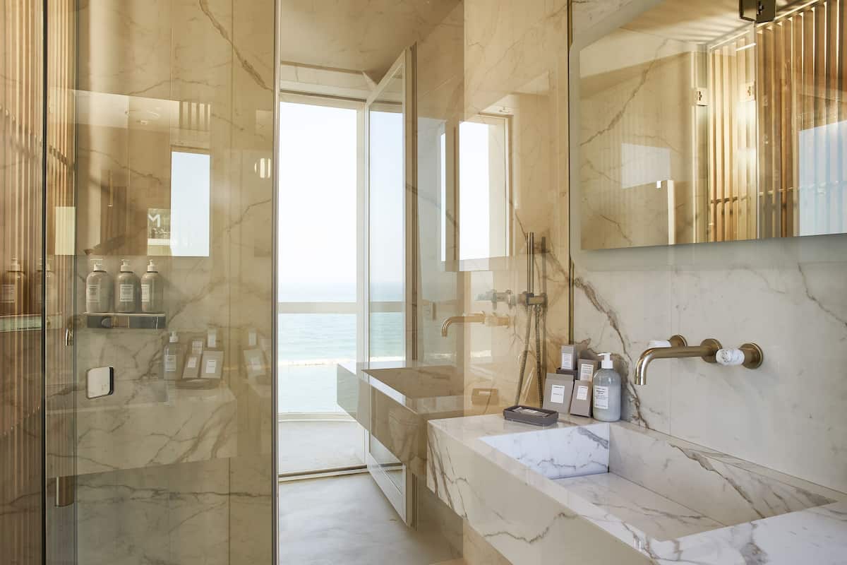 junior studio suite, multiple beds, sea view (levante) | bathroom | rainfall showerhead, hair dryer, slippers, bidet