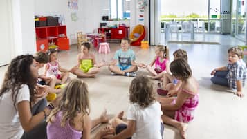 Children can play and learn in this spacious room with a large window, bookshelf, and play area.