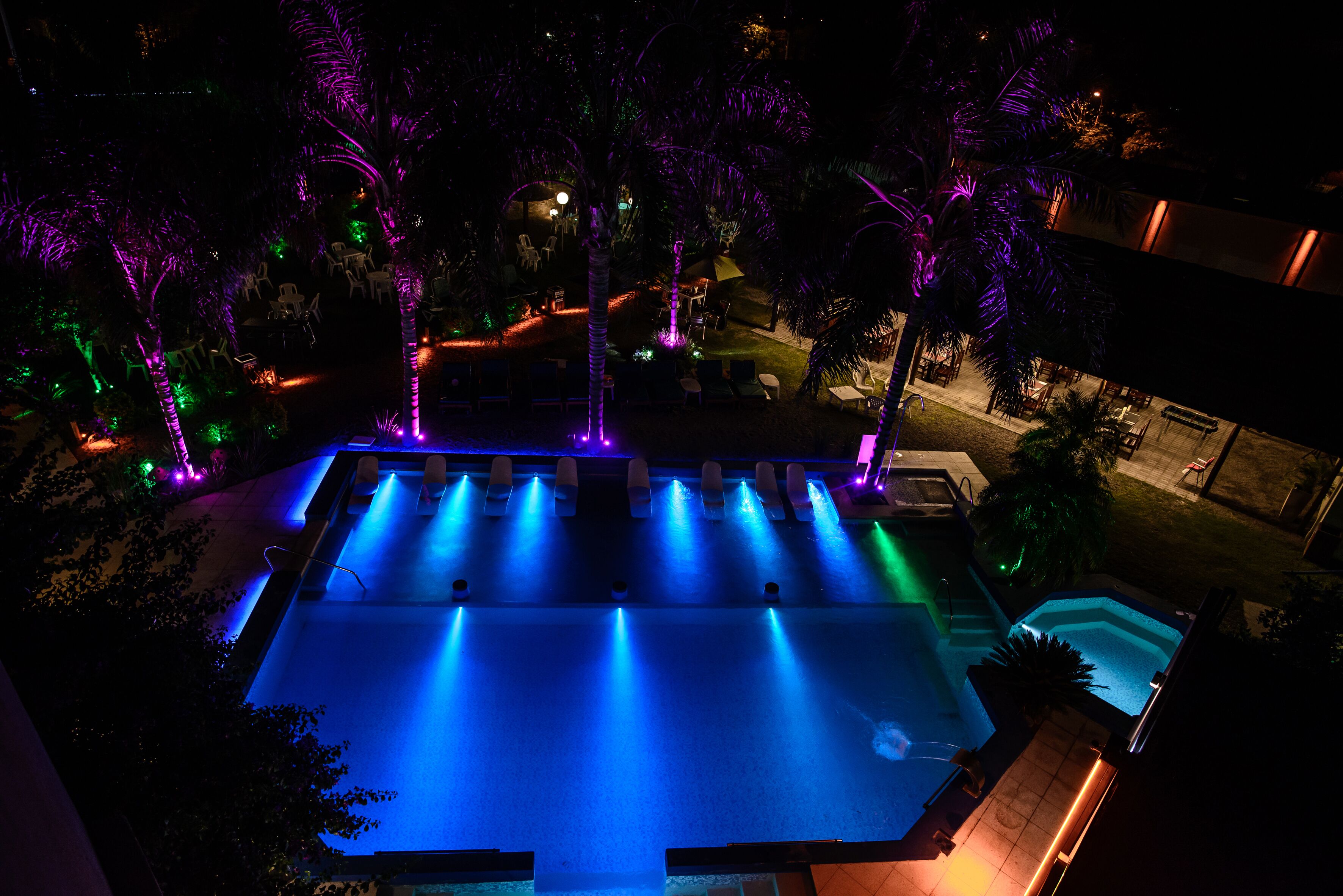 outdoor pool, open 9:00 am to midnight, pool umbrellas, pool loungers