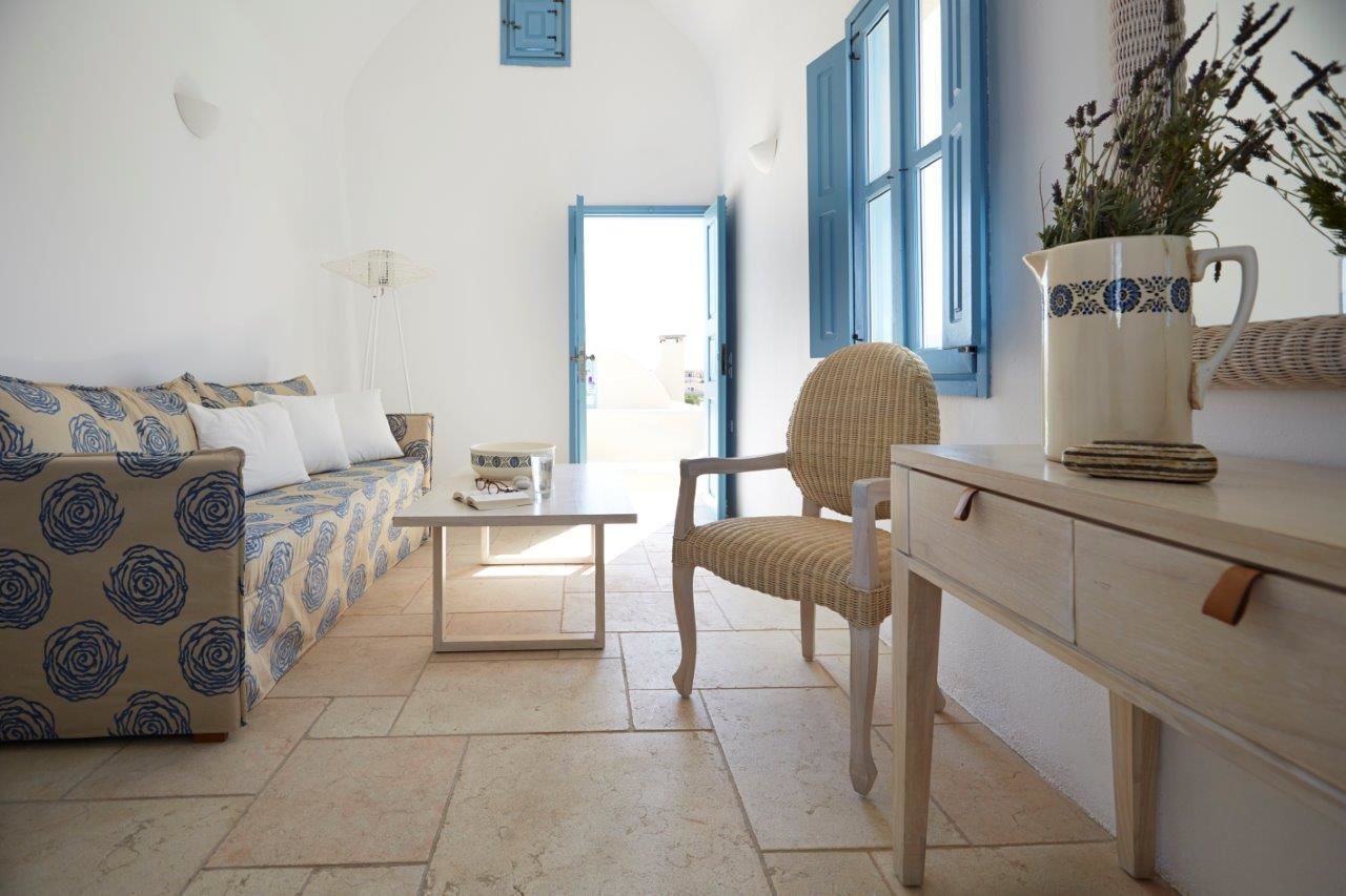 suite with balcony and sea view | living area | 32-inch lcd tv with satellite channels, tv, dvd player