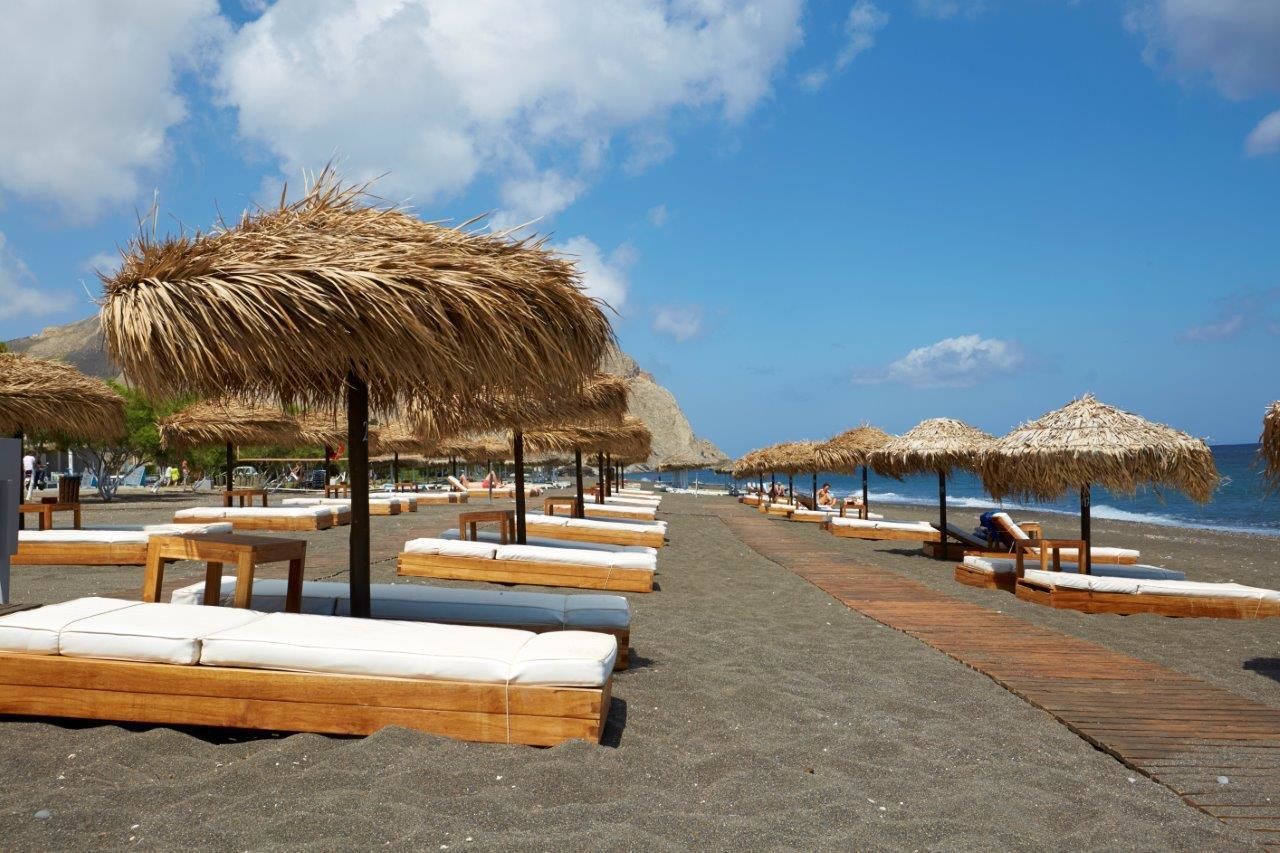 on the beach, sun-loungers, beach umbrellas, beach towels