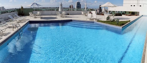 Outdoor pool, pool umbrellas, sun loungers