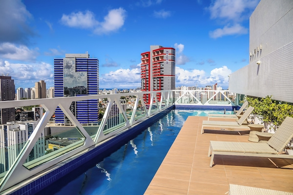 Outdoor pool, open 6:00 AM to 10:00 PM, pool umbrellas, sun loungers