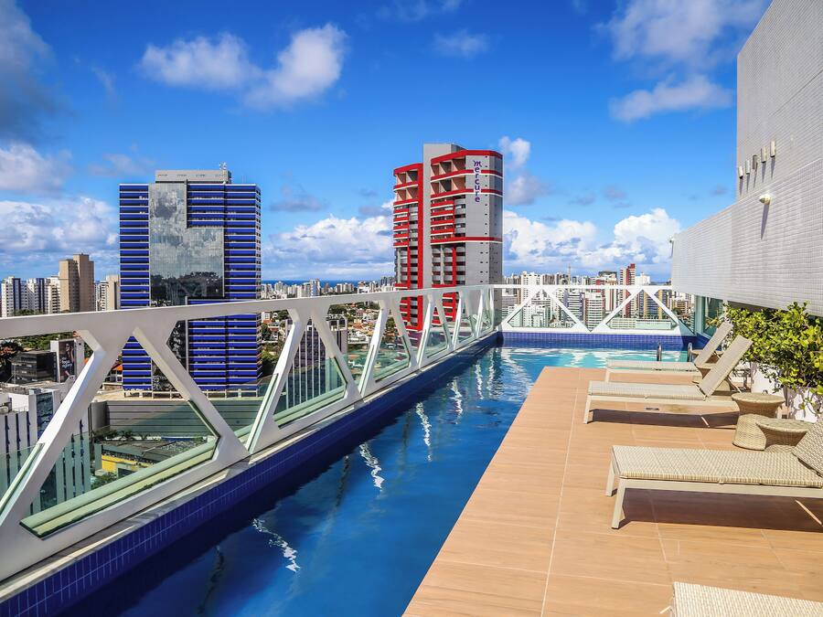 Outdoor pool, open 6:00 AM to 10:00 PM, pool umbrellas, pool loungers