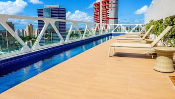 Outdoor pool, open 6:00 AM to 10:00 PM, pool umbrellas, pool loungers